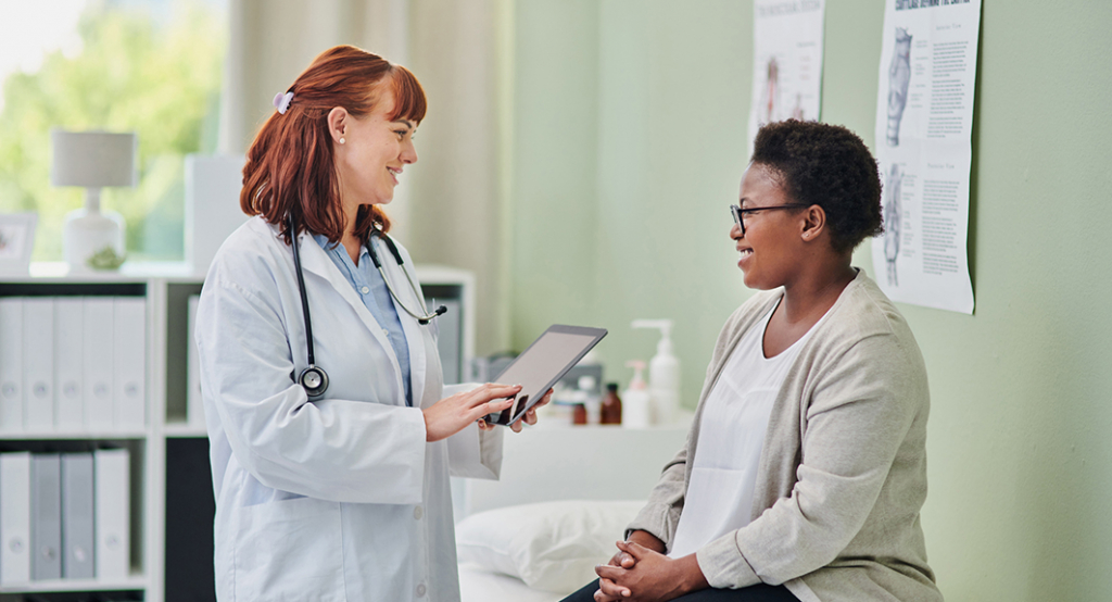 Female doctor attending to female patient