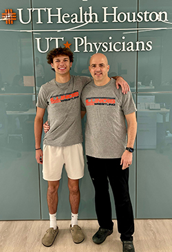 Jackson poses with Paul Shupe, MD after his ACL surgery