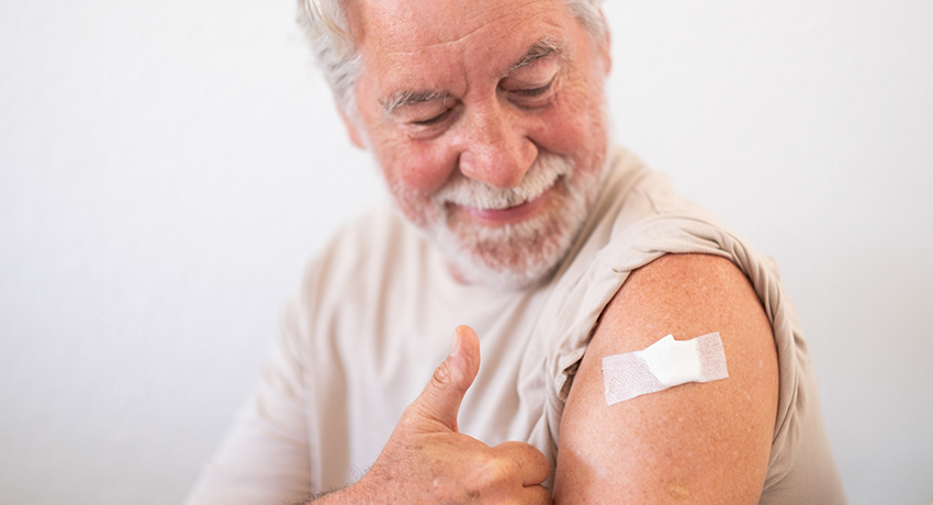 Smiling senior man 70s after receiving the coronavirus covid-19 vaccine