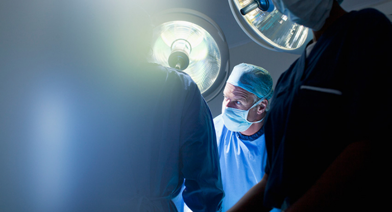 Surgeons working in operating room