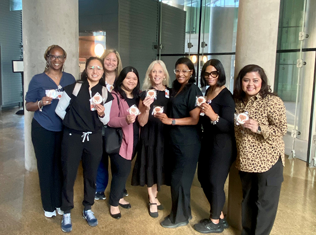 Kathy Hinze with newly hired nurses at orientation