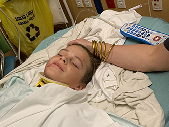 Cole on his first day at the hospital lying on a bed