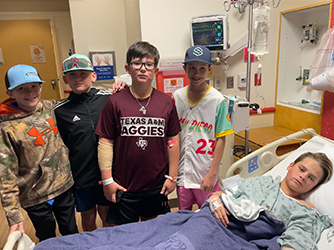 Cole's friends visiting him at the hospital