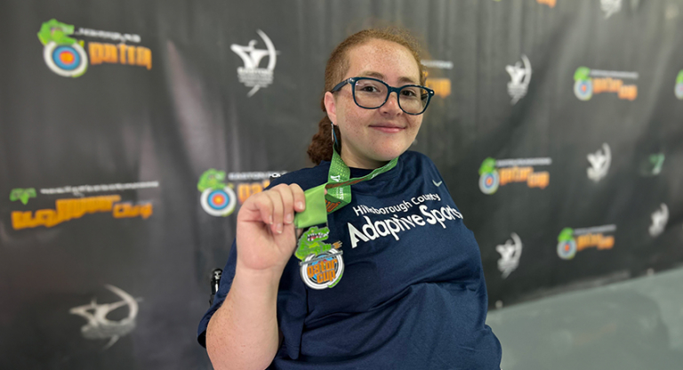 Natalia Rijos posing with medal