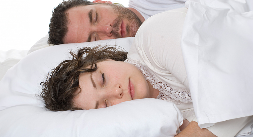 Portrait of young caucasian couple sleeping.